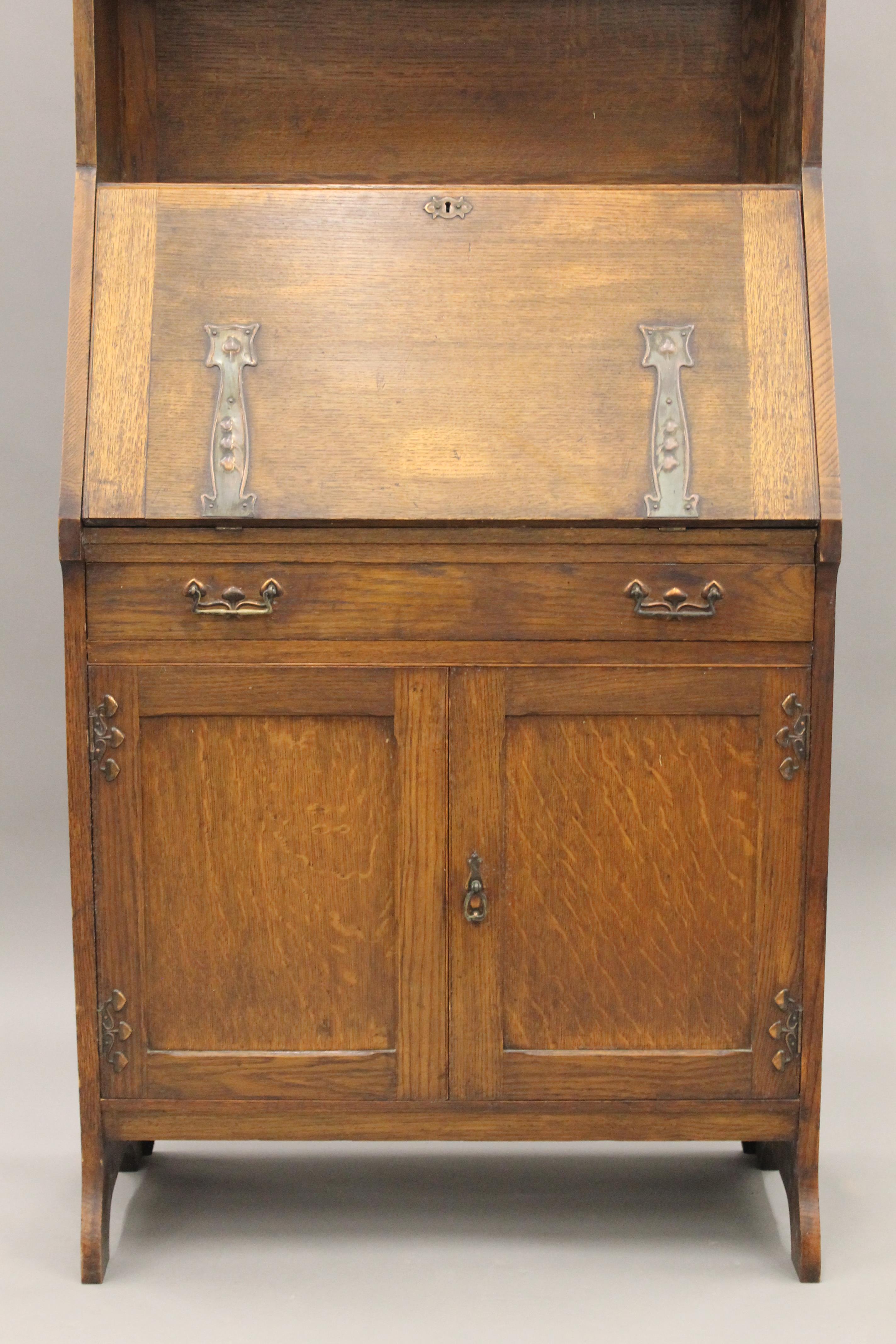 An Arts and Crafts oak hall bureau bookcase. 76 cm wide. - Image 3 of 11