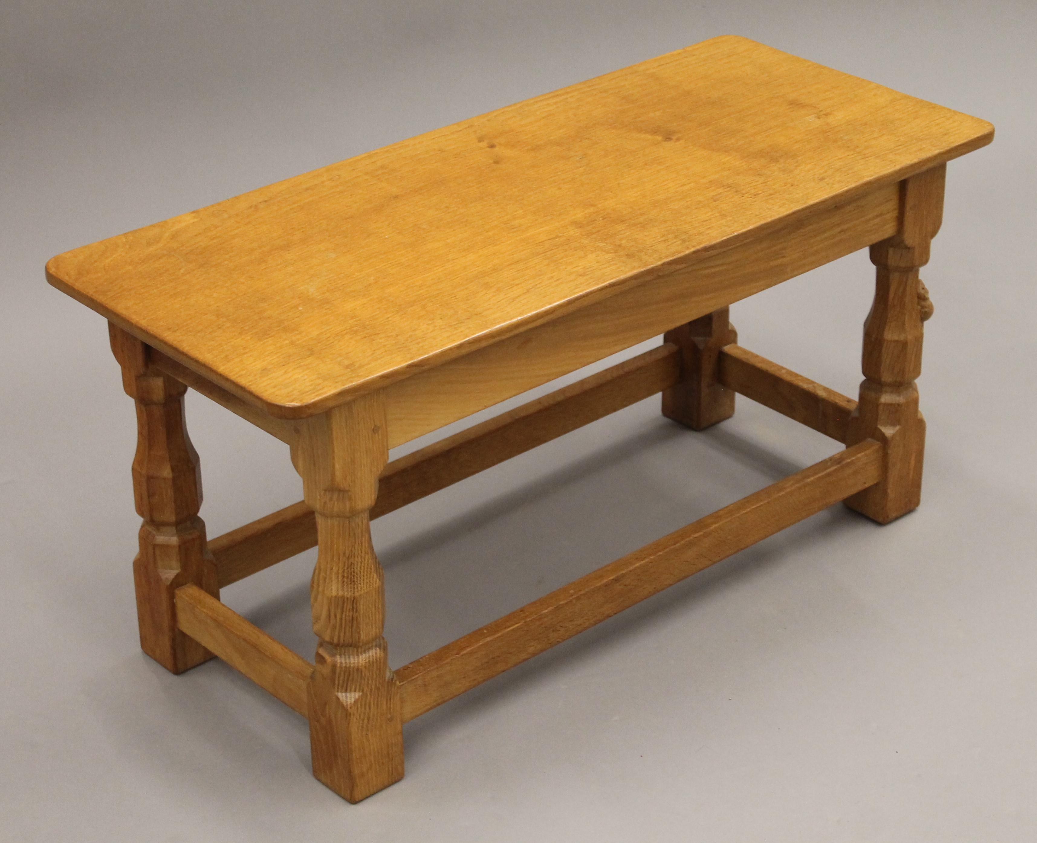 A Robert 'Mouseman' Thompson of Kilburn rectangular adzed oak coffee table. 82 cm long, 35. - Image 2 of 6