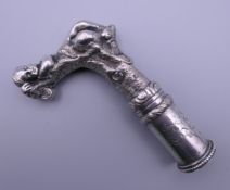 A silver plated walking stick handle. 11.5 cm high.