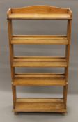 An early 20th century oak standing bookcase. 64 cm wide.