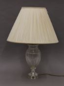 A cut glass lamp and shade. Approximately 70 cm high including shade.