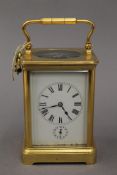 A brass cased carriage clock. 17.5 cm high overall.