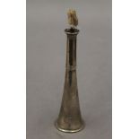 A silver table lighter formed as a hunting horn. 11.5 cm high.