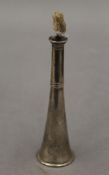 A silver table lighter formed as a hunting horn. 11.5 cm high.