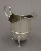 A silver cream jug, hallmarked Birmingham 1906. 10 cm high. 3.5 troy ounces.