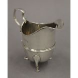 A silver cream jug, hallmarked Birmingham 1906. 10 cm high. 3.5 troy ounces.
