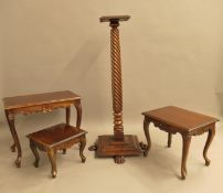 A mahogany torchere and three side tables. 123 cm high.