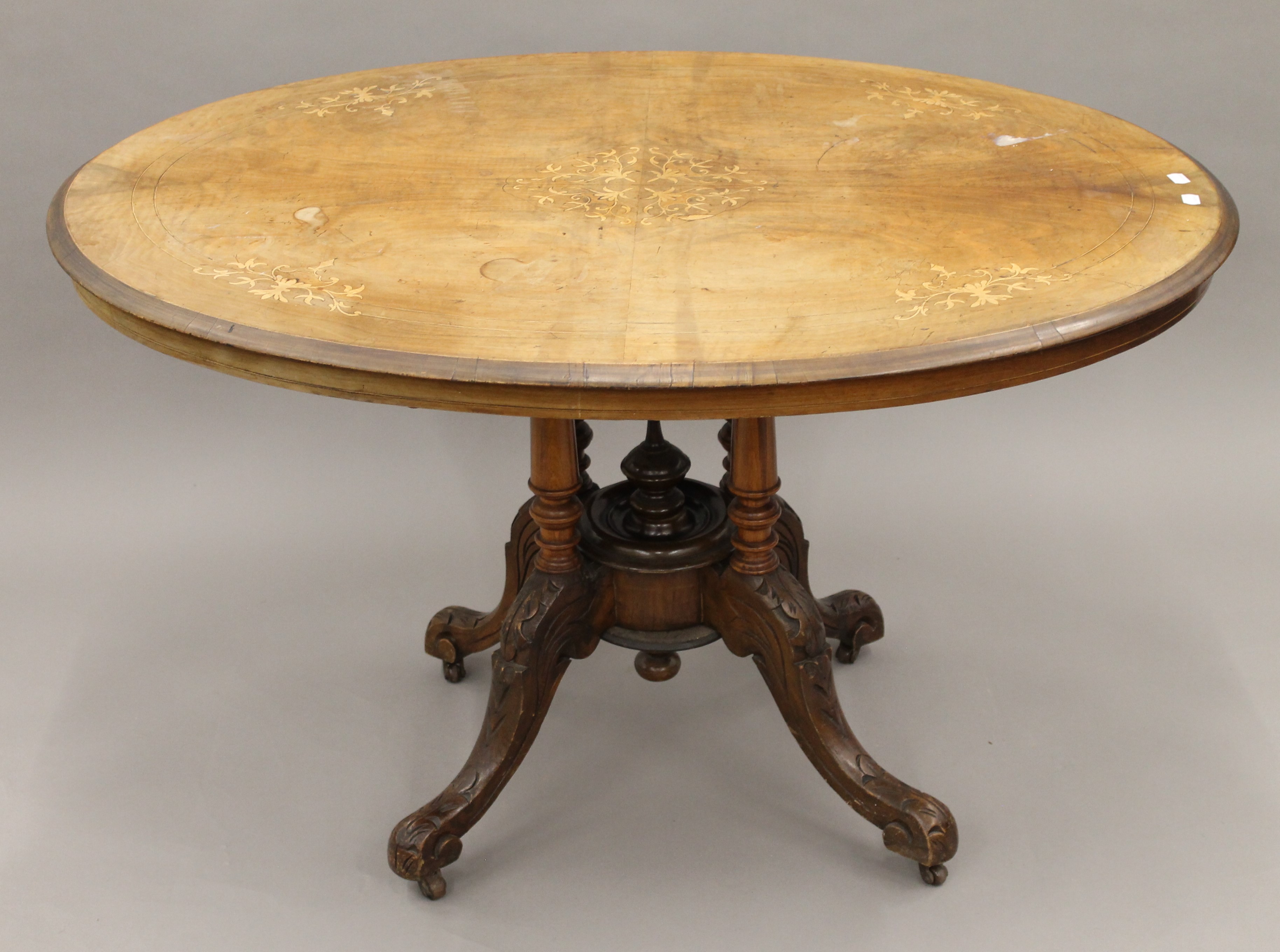 A Victorian walnut loo table. 117 cm long.