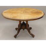 A Victorian walnut loo table. 117 cm long.