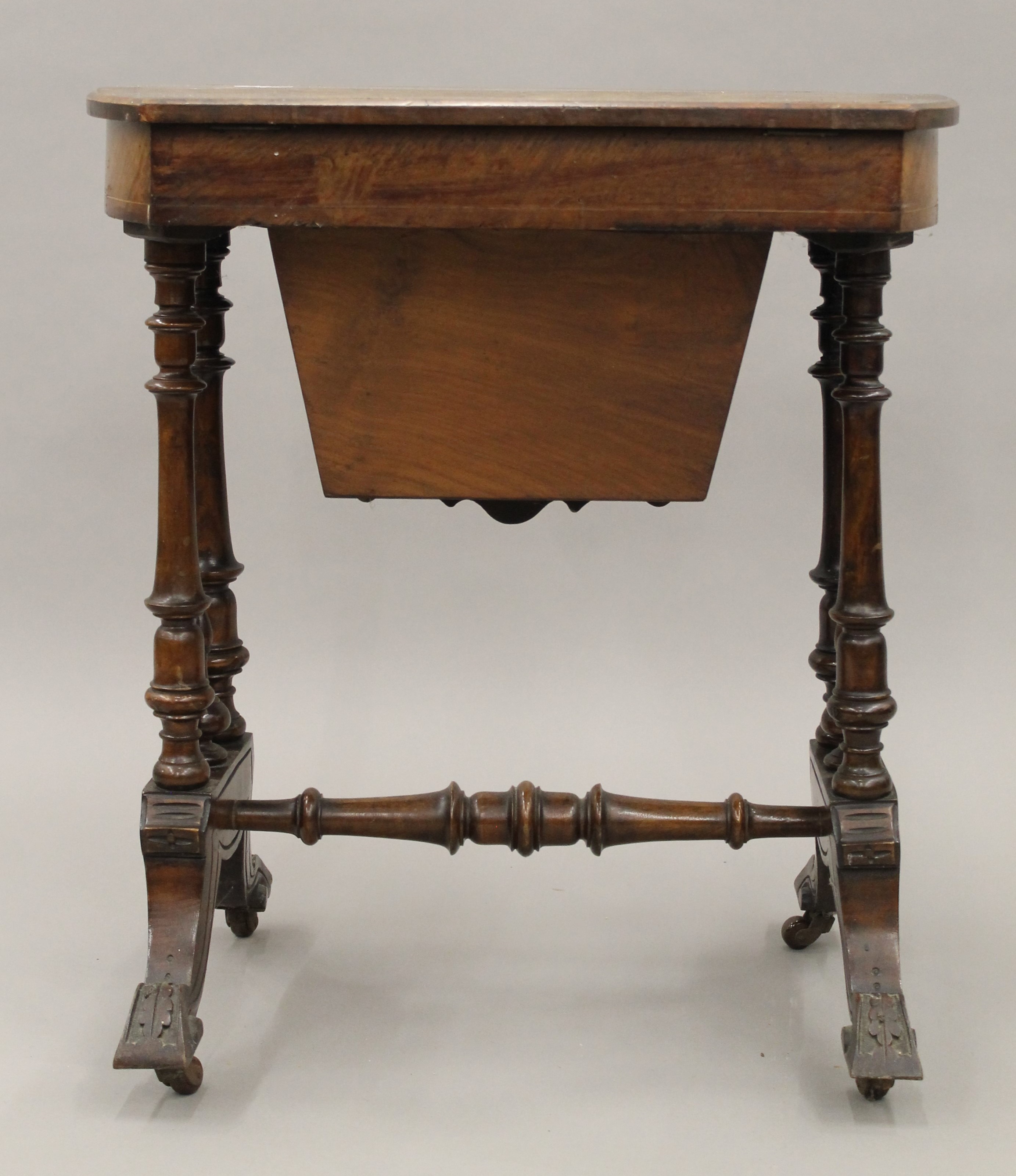 A Victorian inlaid burr walnut work table. - Image 6 of 6