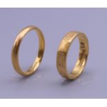 Two 22 ct gold wedding bands. Ring size J and L. 7.7 grammes.