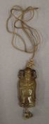 A Chinese agate carving of a dignitary suspended on a silk as a pendant. 6 cm high.