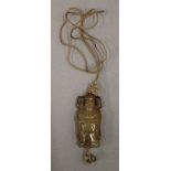 A Chinese agate carving of a dignitary suspended on a silk as a pendant. 6 cm high.