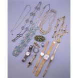 A quantity of costume jewellery and watches.