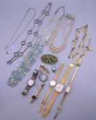 A quantity of costume jewellery and watches.