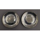 Two boxed coin set silver dishes. Each 10 cm diameter. 4.5 troy ounces total weight.