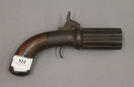 A 19th century pepper box pistol. 19.5 cm long.