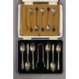 A cased set of silver teaspoons and tongs, and a part set of silver coffee spoons. 4.