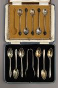 A cased set of silver teaspoons and tongs, and a part set of silver coffee spoons. 4.