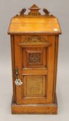 A Victorian walnut pot cupboard. 41 cm wide.