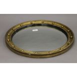 An early 20th century gilt framed convex mirror. 49 cm diameter.