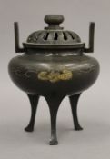 A Chinese unmarked silver inlaid bronze lidded censer. 12 cm high.