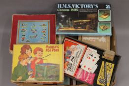 A quantity of vintage jigsaw puzzles and games.