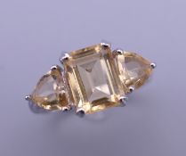A silver citrine ring. Ring size O.
