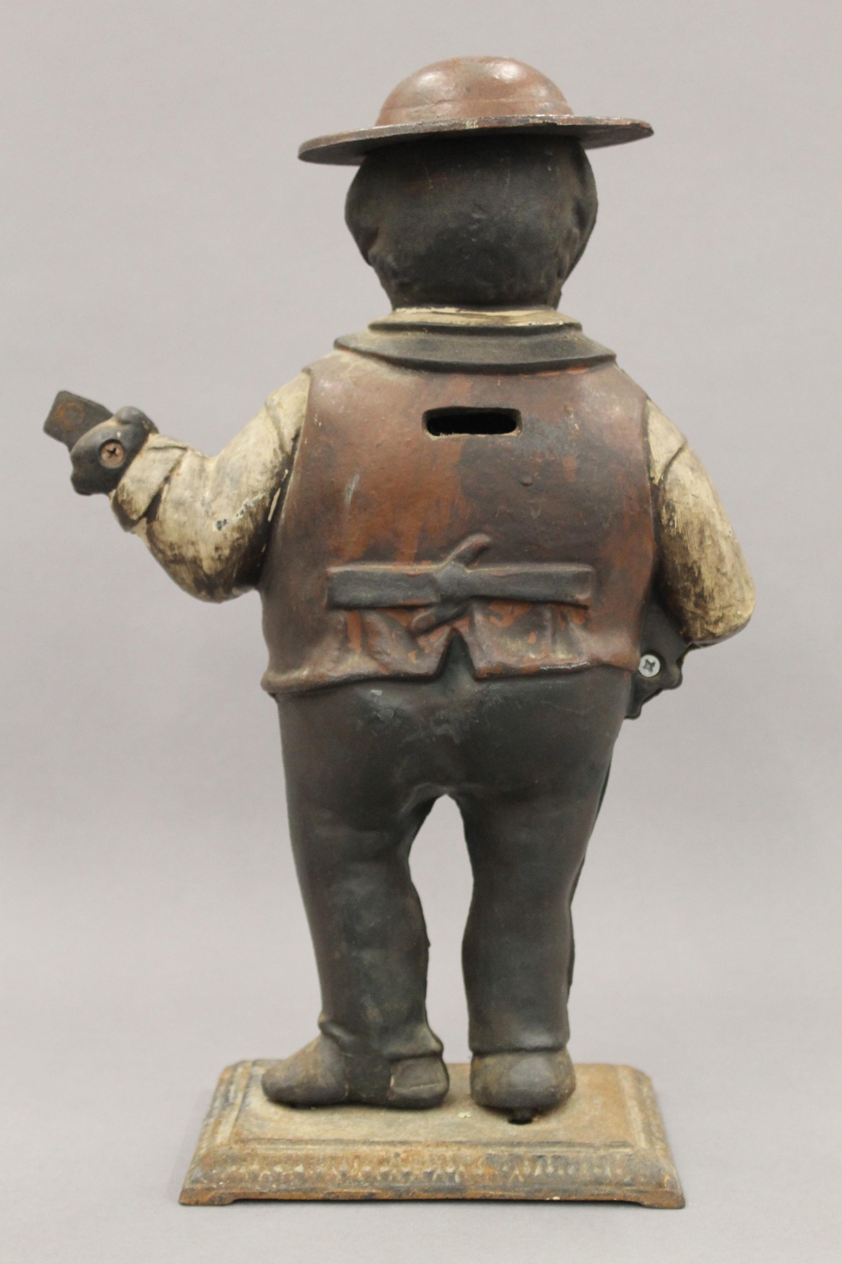 A cast iron figural clock case. 39 cm high. - Image 4 of 4