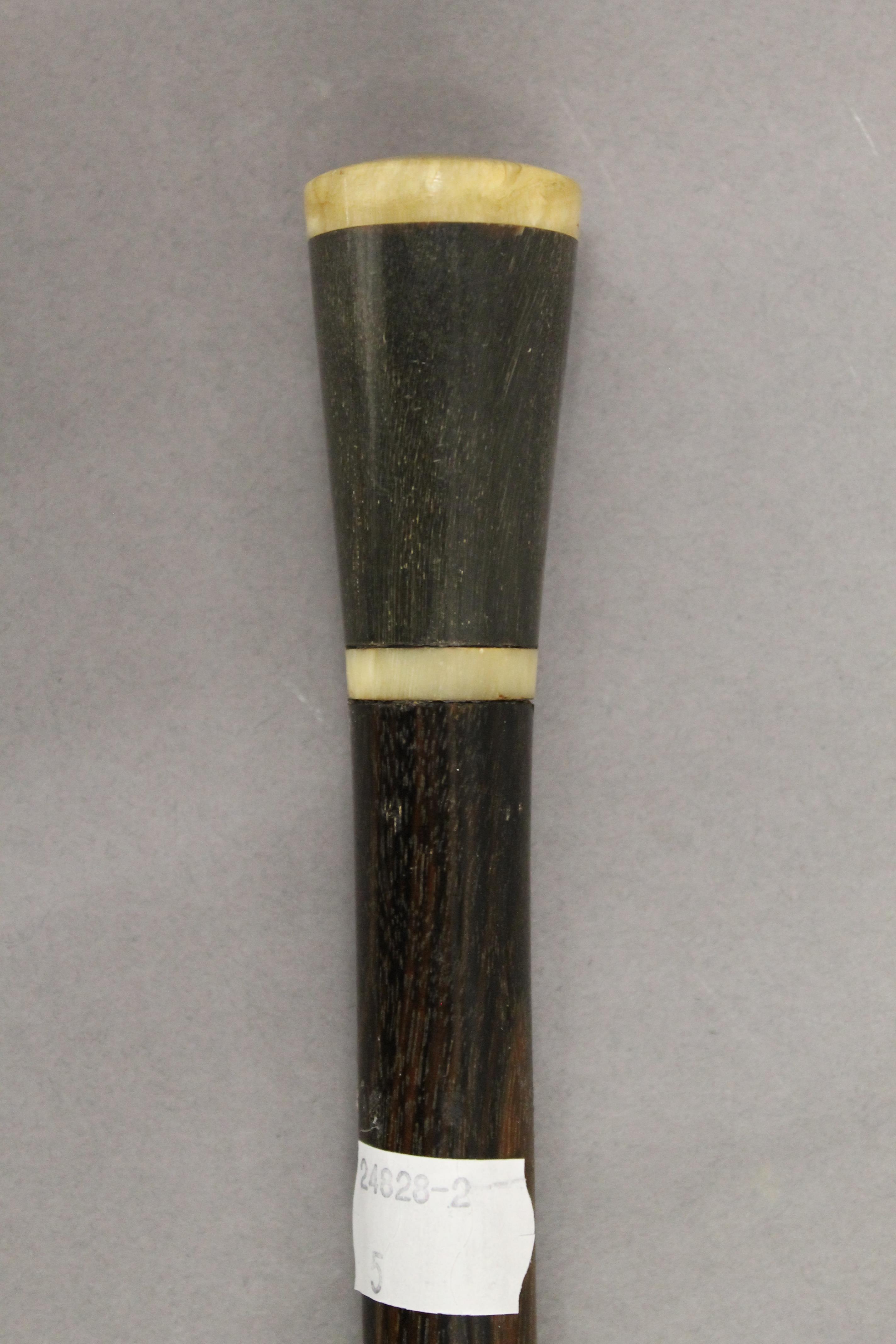 A horn handled walking stick and a Regimental walking stick. The former 90 cm high. - Image 2 of 3