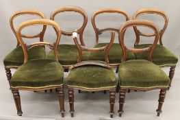 Seven various Victorian mahogany balloon back chairs.