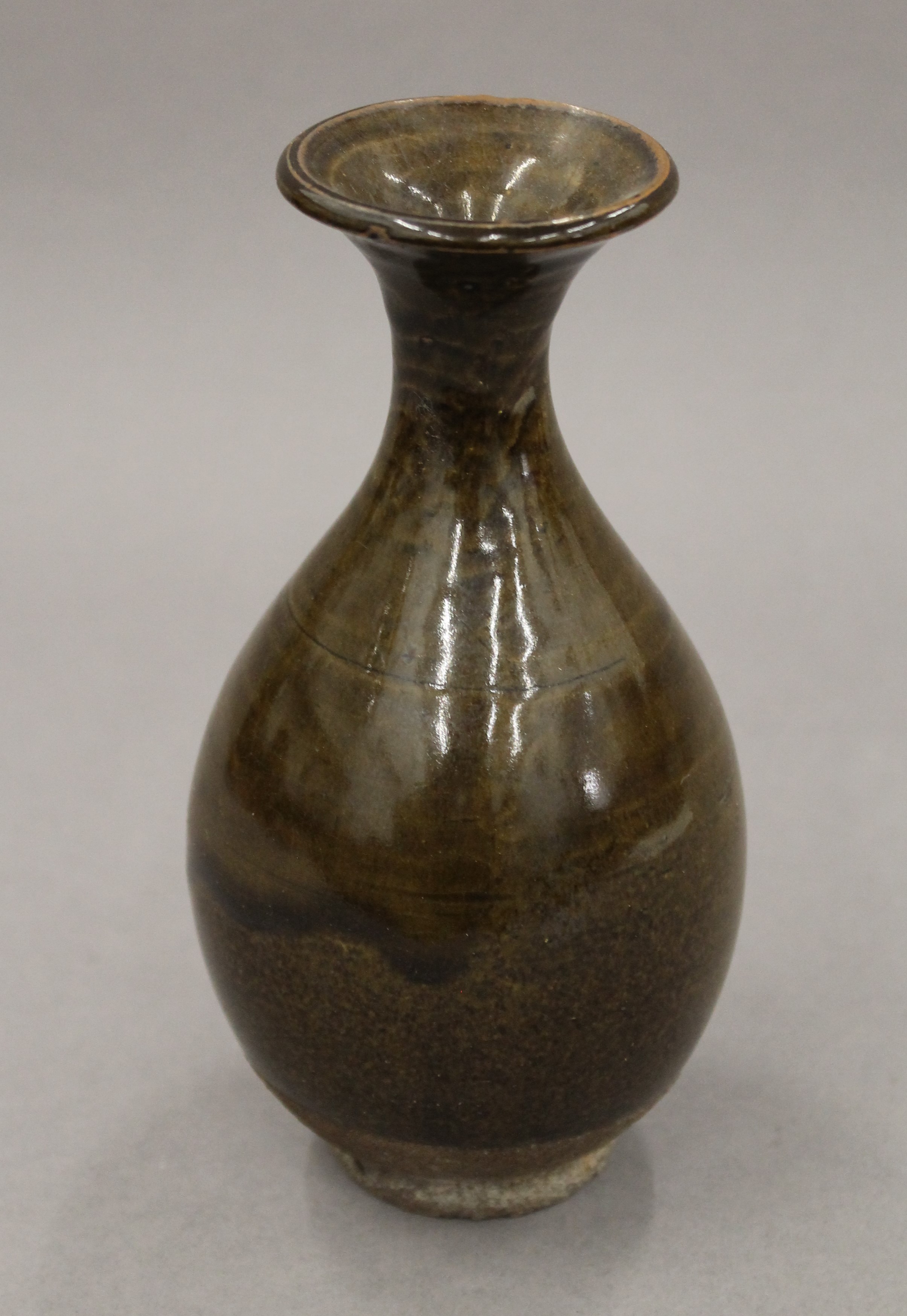 A small olive glazed pottery vase. 17 cm high. - Image 2 of 2