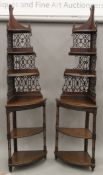 A pair of Edwardian mahogany corner whatnots. Each 223.