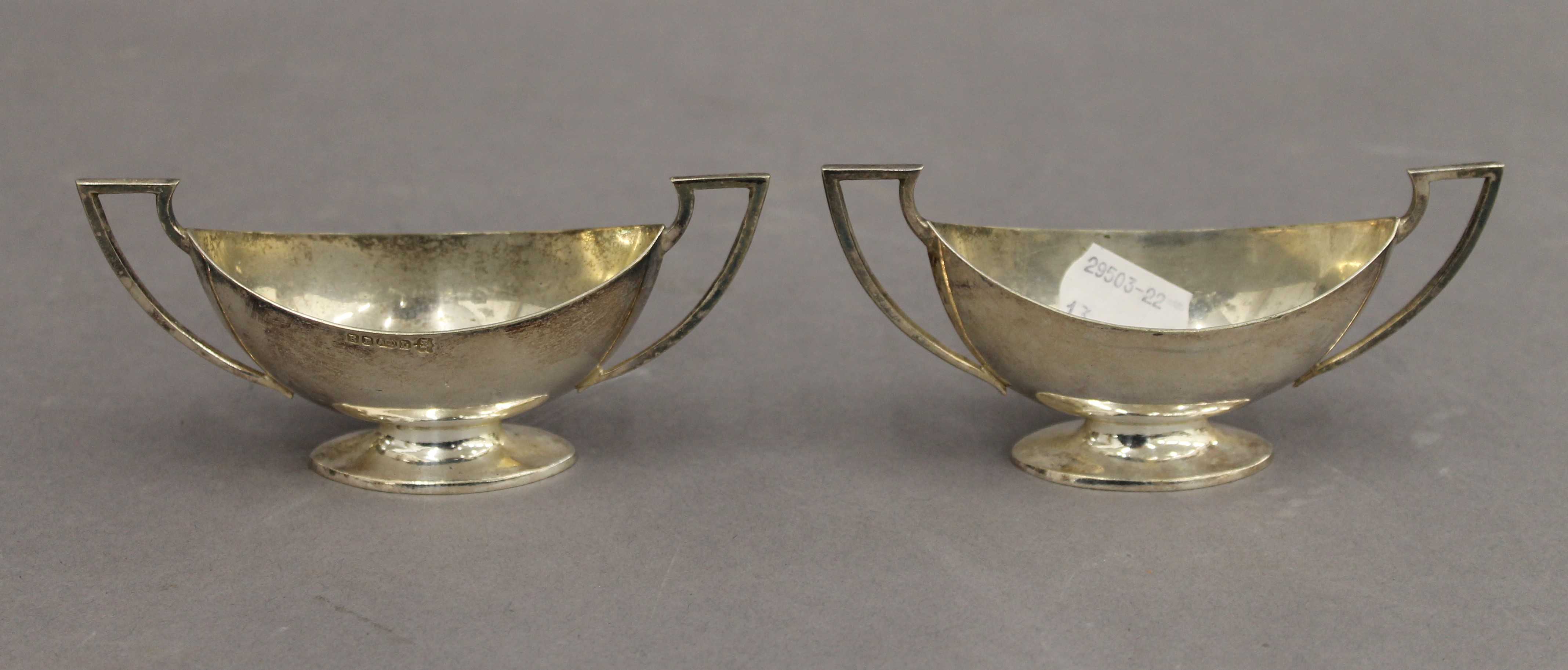 WITHDRAWN A pair of silver twin handled pedestal salts. 12.25 cm wide. 3.9 troy ounces. - Image 2 of 5