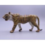 A cold painted bronze model of a tiger. 12 cm long.