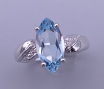A silver aquamarine ring. Ring size O/P.