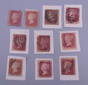 Ten Victorian penny red stamps.