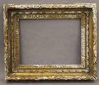 An 18th century carved wooden frame. 47 x 56 cm.