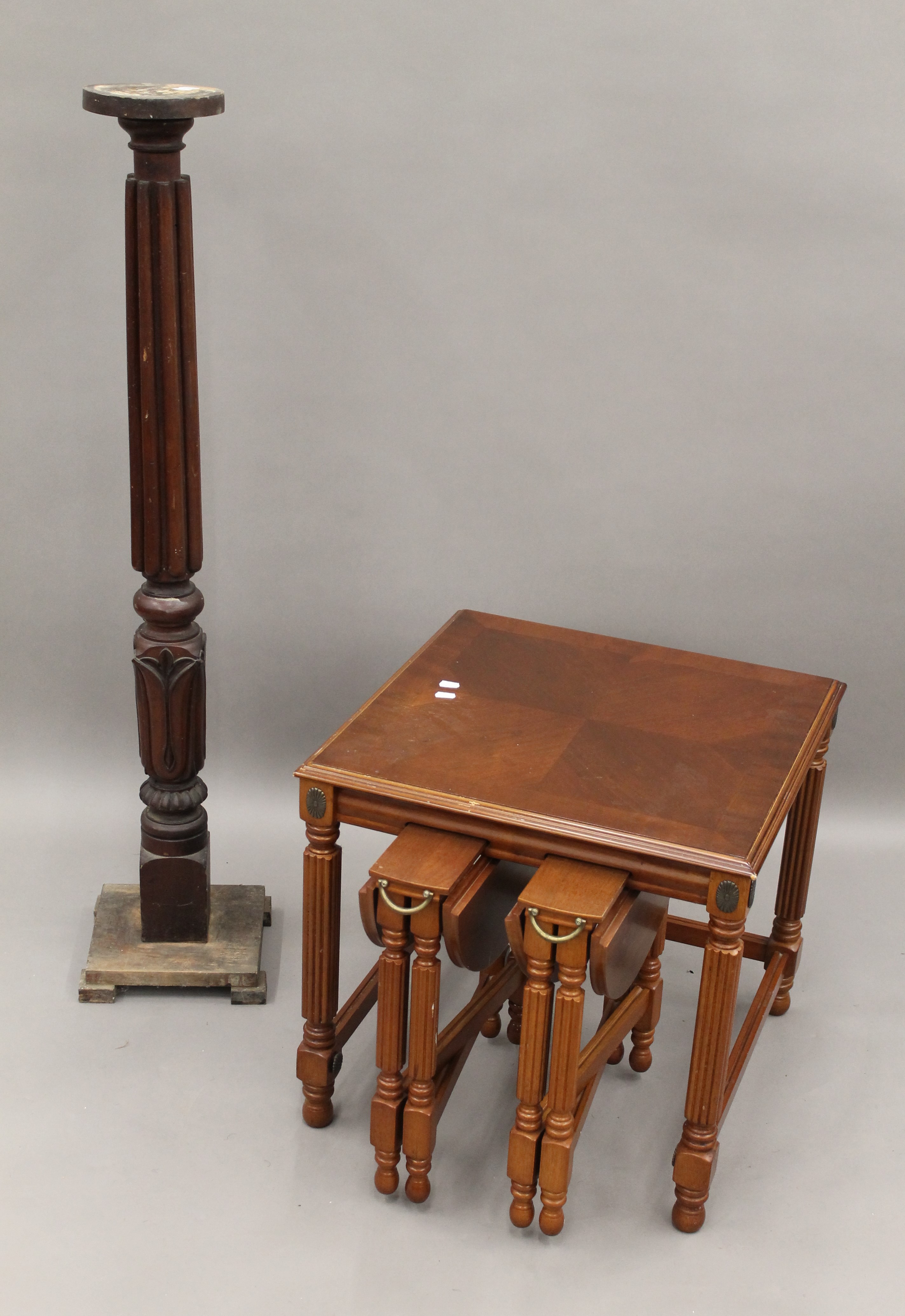 A modern nest of tables and a torchere. The latter 123.5 cm high.