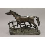 A bronze model of a horse. 23 cm wide.