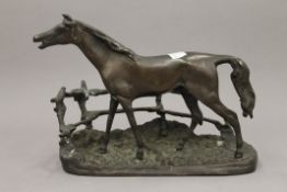 A bronze model of a horse. 23 cm wide.