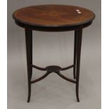 An Edwardian inlaid mahogany oval side table. 65 cm wide, 45 cm deep, 73 cm high.