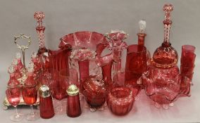 A large quantity of various cranberry glass