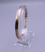 A 9 ct rose gold ID bracelet. 16 grammes. 18.5 cm long.