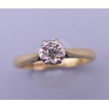 An 18 ct gold diamond solitaire ring. Ring size L. 2.8 grammes total weight.
