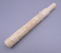 A Japanese bone cigar holder. 24.5 cm long.