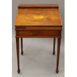A 19th century inlaid mahogany clerk's desk. 61 cm wide.