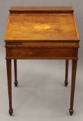 A 19th century inlaid mahogany clerk's desk. 61 cm wide.