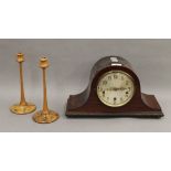 A pair of penwork candlesticks and a mantle clock. The former each 25.5 cm high.