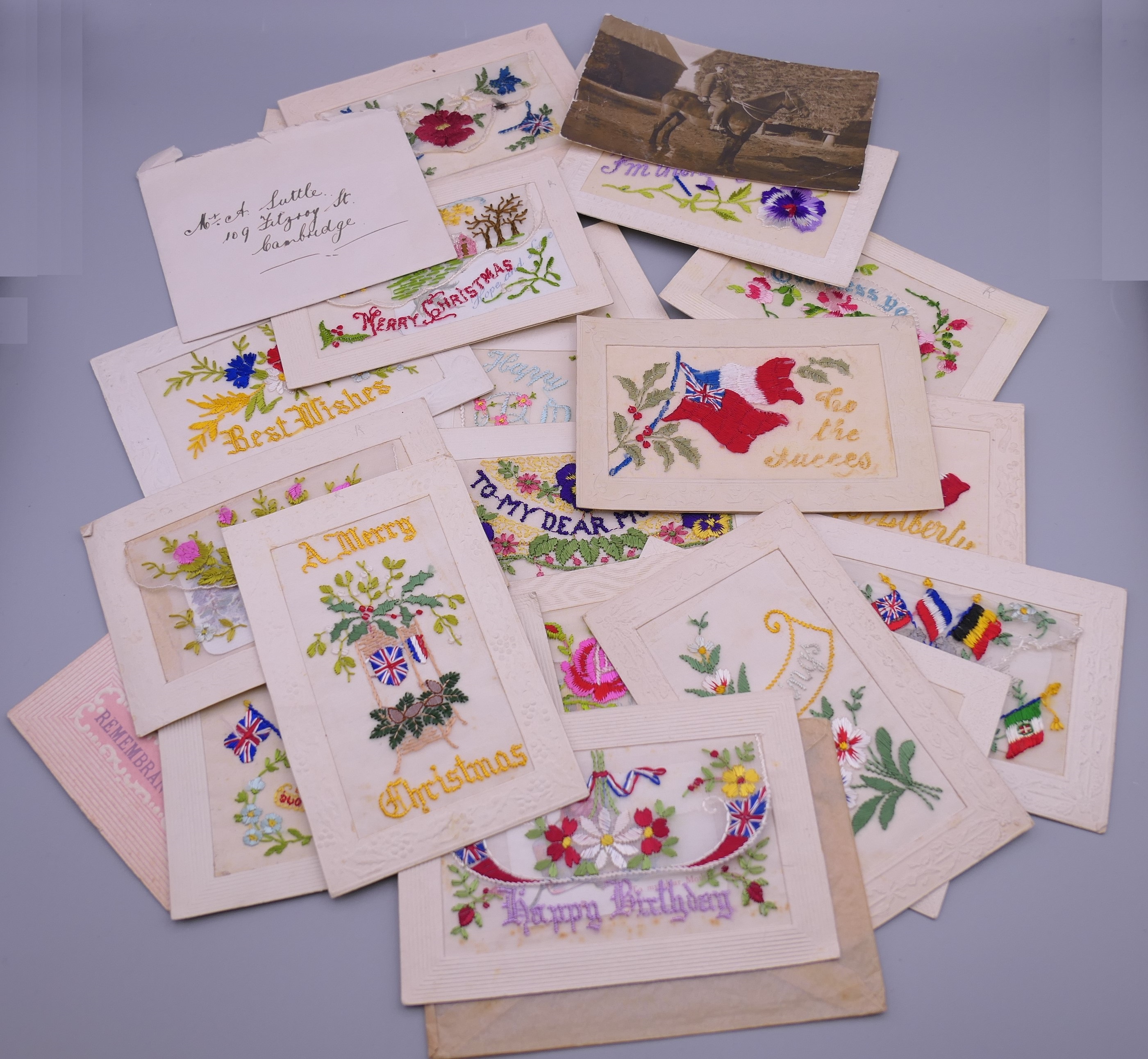 A collection of WWI silk postcards.